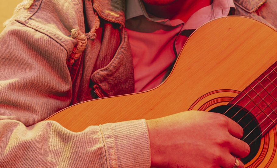 close-up-hand-playing-acoustic-guitar